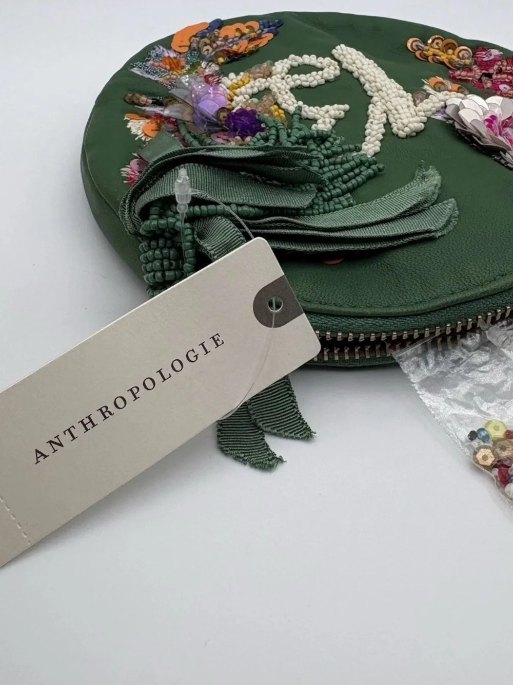 Anthropologie Green Round Embellished Wristlet with Floral Appliqué